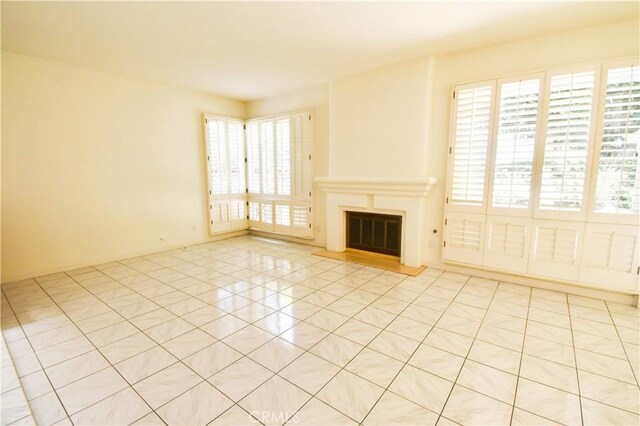 unfurnished living room with light tile patterned floors