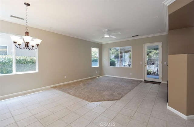 spare room featuring ceiling fan with notable chandelier, light colored carpet, a wealth of natural light, and ornamental molding