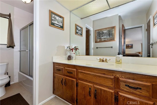 full bathroom featuring vanity, toilet, and enclosed tub / shower combo