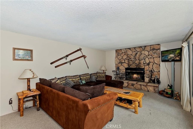 living room featuring a fireplace, a textured ceiling, and light colored carpet