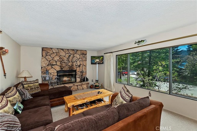 living room featuring carpet flooring, a textured ceiling, and a stone fireplace