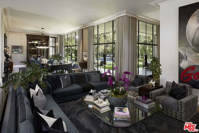 interior space with crown molding and an inviting chandelier