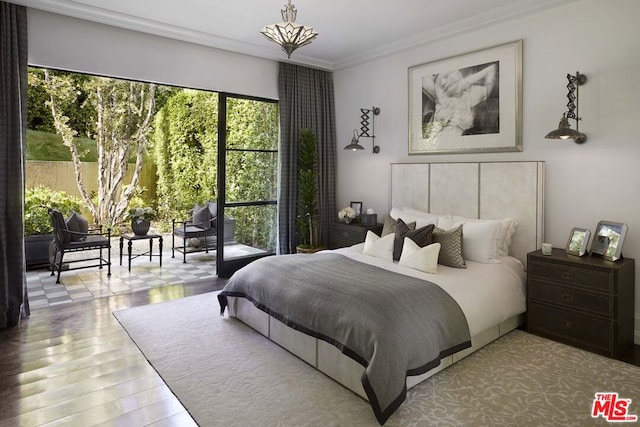 bedroom featuring wood-type flooring and crown molding