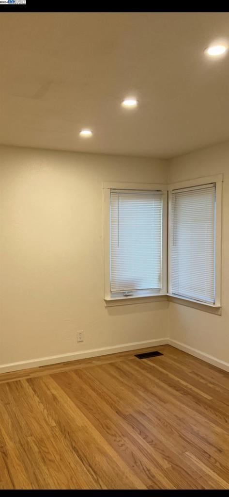 empty room featuring hardwood / wood-style floors