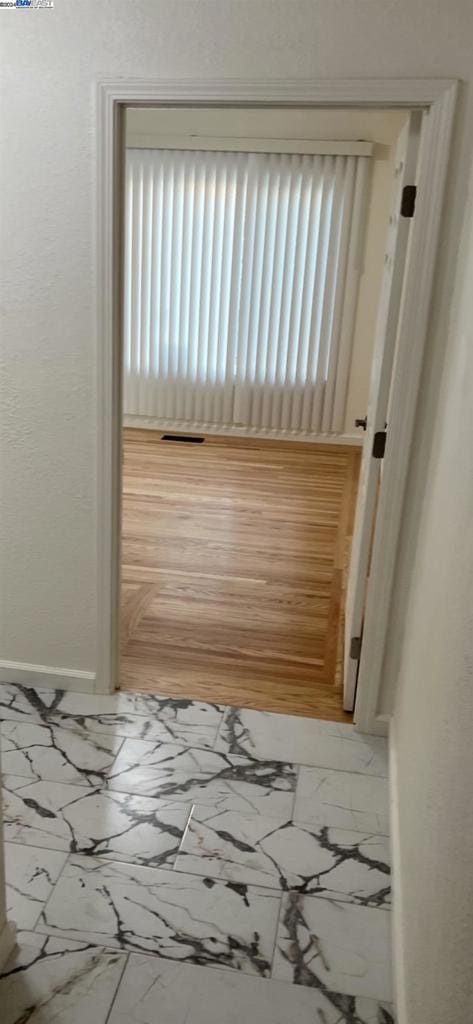 hallway featuring hardwood / wood-style flooring