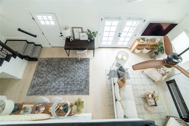 living room featuring french doors and hardwood / wood-style flooring