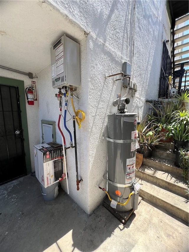 utility room with water heater