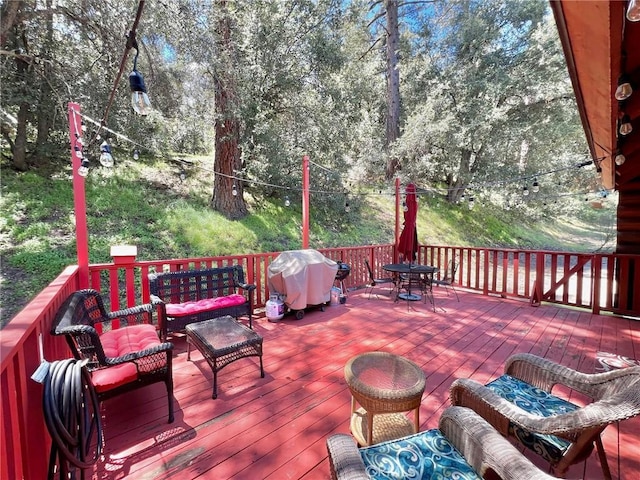 wooden terrace featuring area for grilling