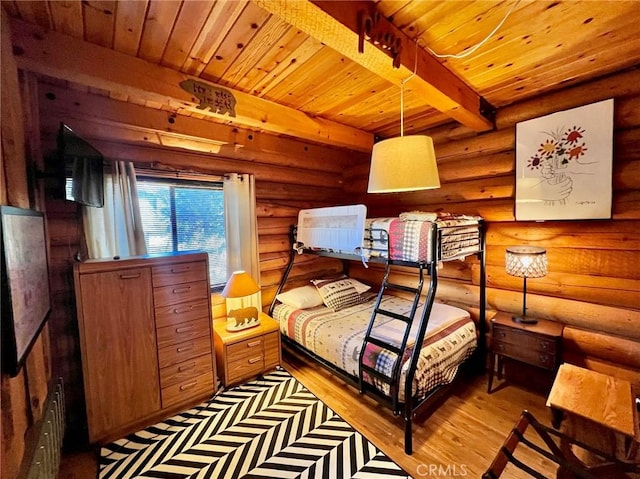 bedroom featuring beamed ceiling, light hardwood / wood-style flooring, rustic walls, and wood ceiling