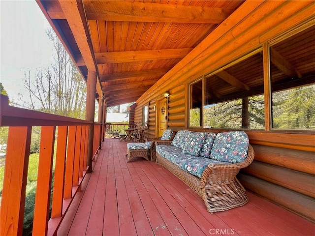 wooden terrace with a porch