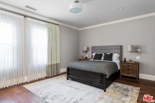 bedroom featuring hardwood / wood-style floors and ornamental molding