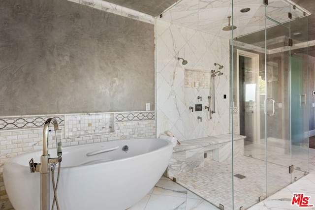 bathroom featuring separate shower and tub, tile patterned flooring, and tile walls