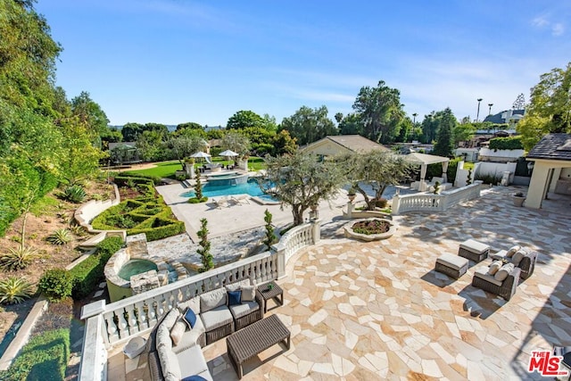 view of pool with outdoor lounge area and a patio area