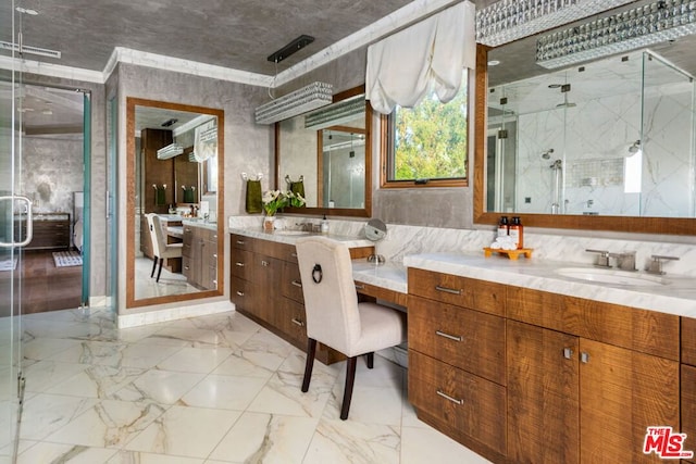 bathroom with a shower with door, tile patterned flooring, vanity, ornamental molding, and tile walls