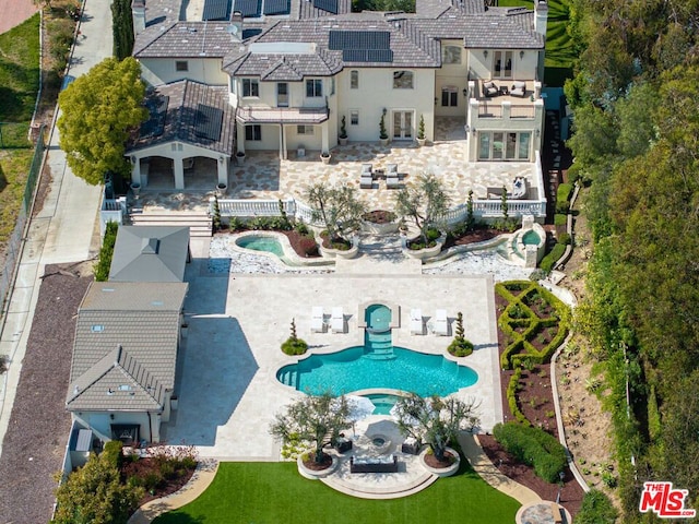 view of swimming pool featuring a patio area