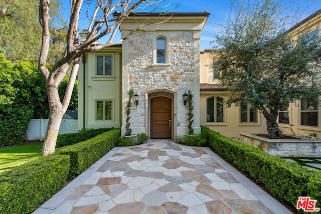 view of front of house with a patio area