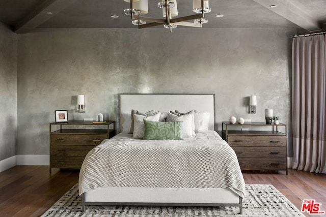 bedroom with hardwood / wood-style flooring and beamed ceiling