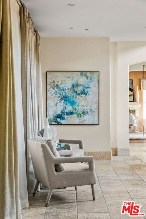 sitting room featuring light tile patterned floors