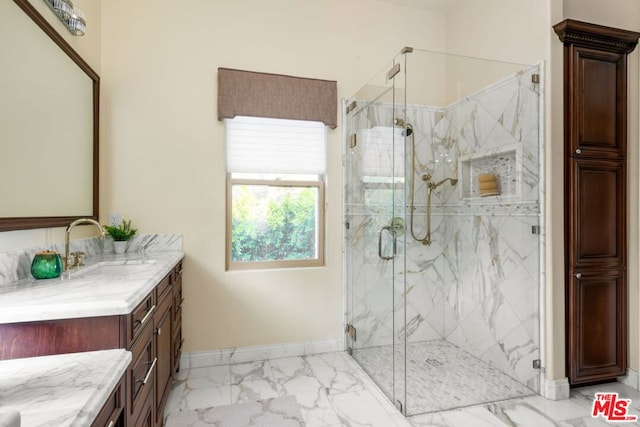 bathroom with tile patterned flooring, vanity, and walk in shower