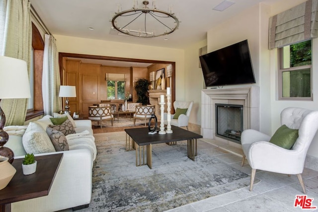 tiled living room with a chandelier