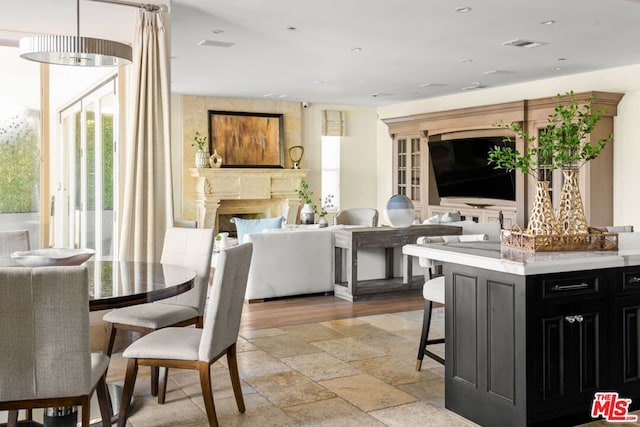 interior space featuring light wood-type flooring and a kitchen bar