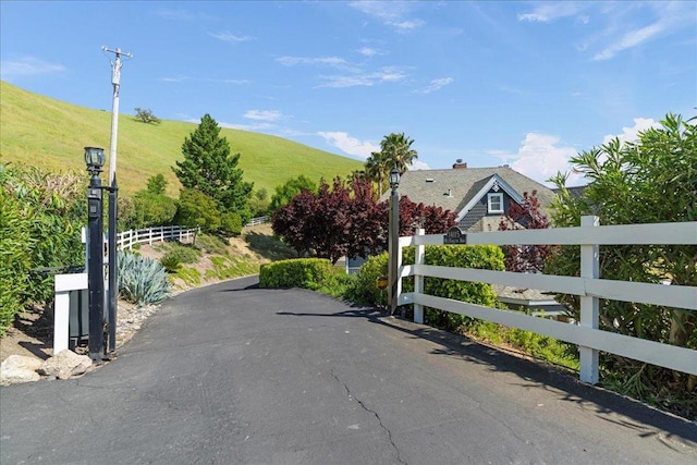 view of road with a mountain view and a rural view