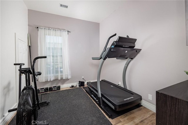 exercise area featuring hardwood / wood-style floors