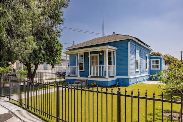 bungalow-style home featuring a front lawn and a porch