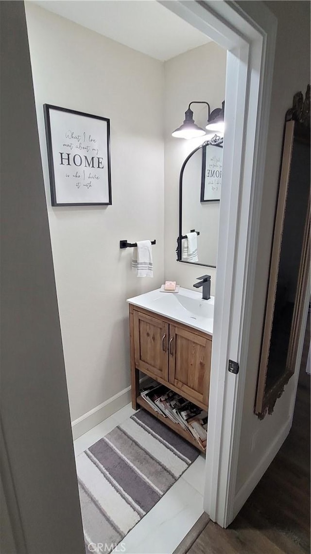 bathroom featuring hardwood / wood-style floors and vanity