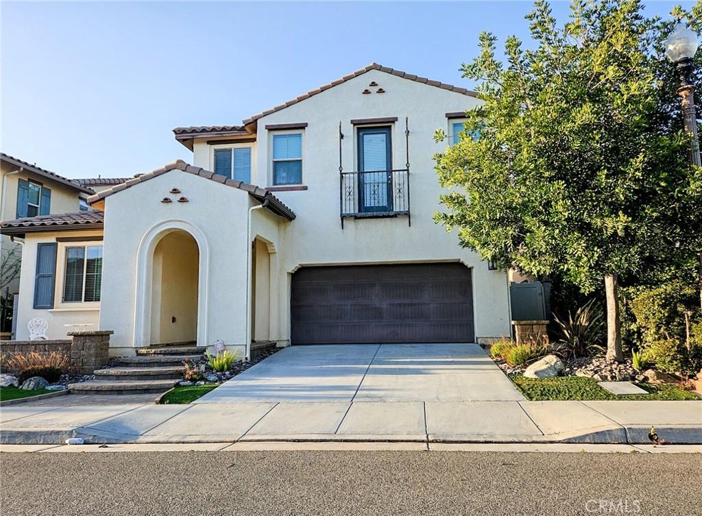 mediterranean / spanish house with a garage