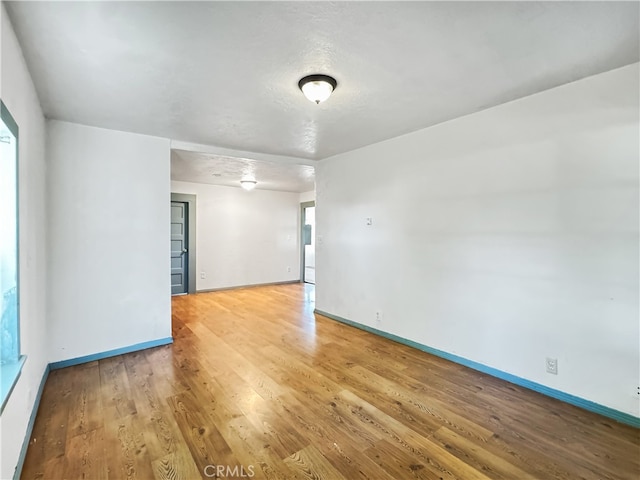 empty room with light wood-type flooring