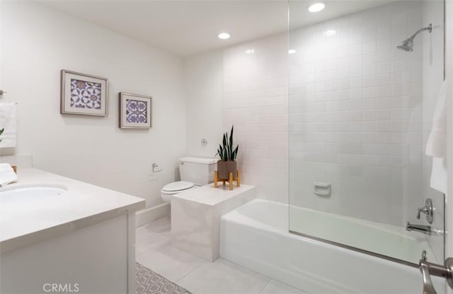 full bathroom with tile patterned floors, vanity, toilet, and tiled shower / bath combo