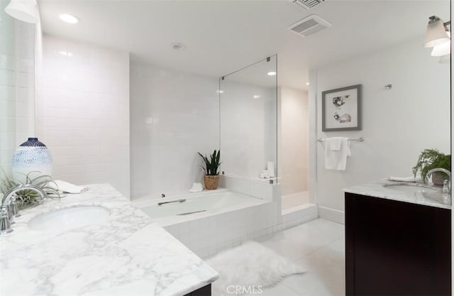 bathroom featuring tile patterned floors, vanity, and independent shower and bath