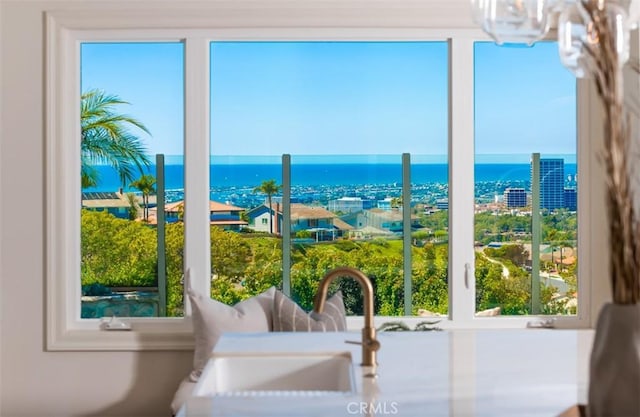 entryway featuring sink and a water view