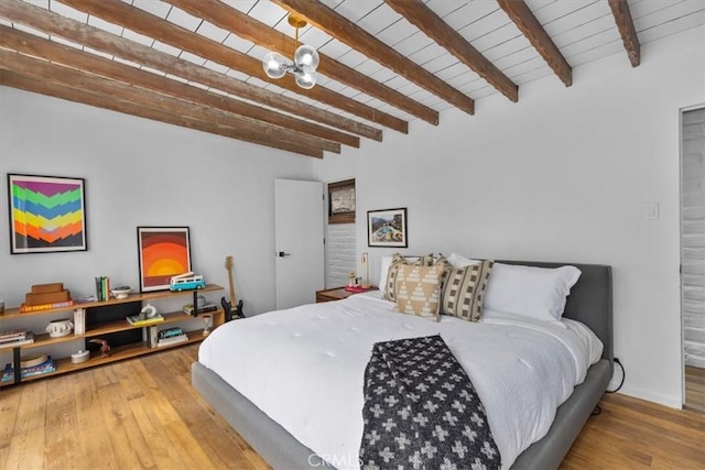 bedroom with wooden ceiling, beam ceiling, wood-type flooring, and a notable chandelier