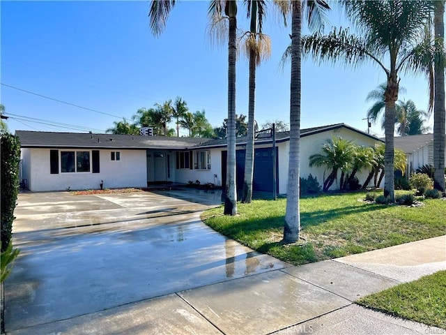 ranch-style home with a front yard