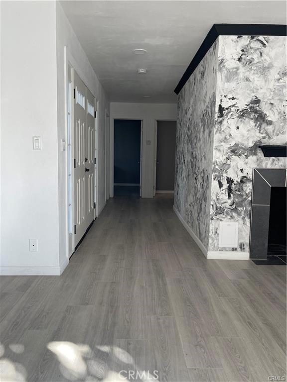 hall with hardwood / wood-style flooring