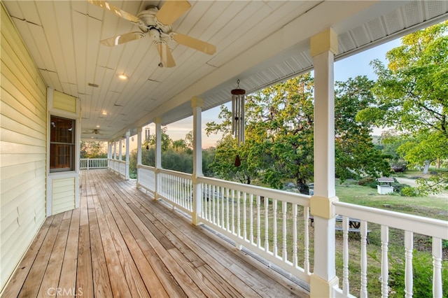 wooden deck with ceiling fan and a porch