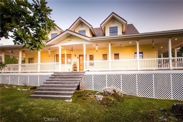 farmhouse with a yard and a porch