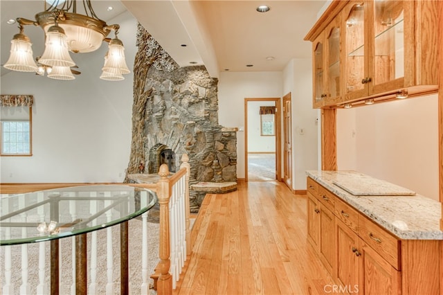 hall with light hardwood / wood-style flooring