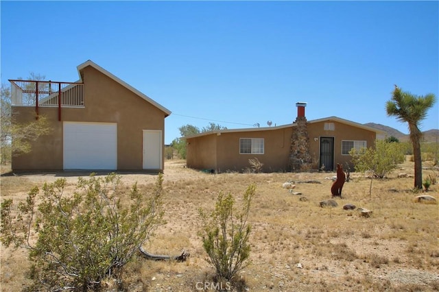 view of side of property featuring a garage