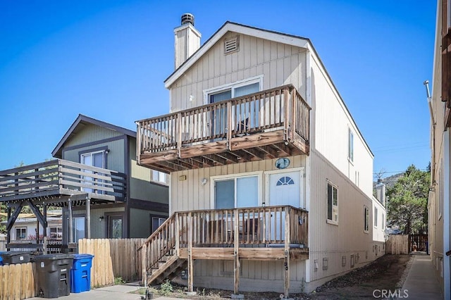 back of house with a balcony