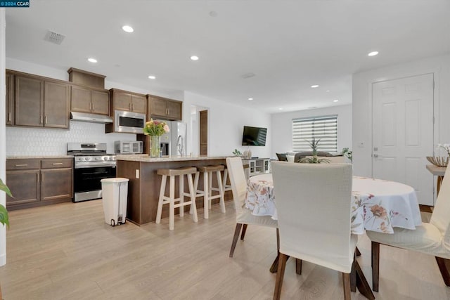 dining space featuring light hardwood / wood-style flooring