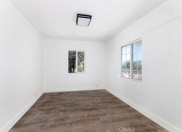 empty room featuring dark wood-type flooring