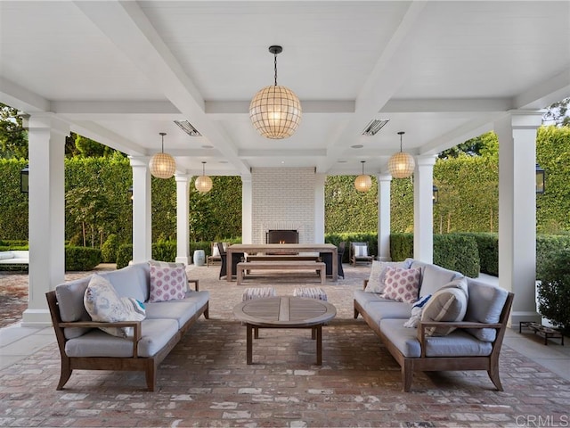 view of patio featuring an outdoor living space with a fireplace