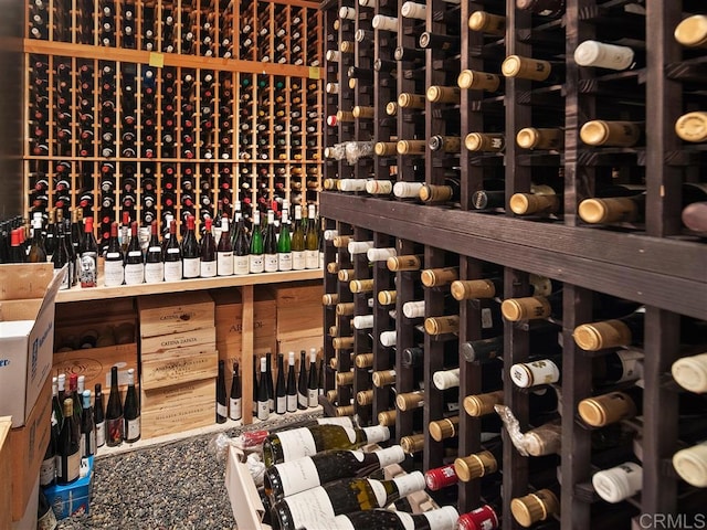 wine room with lofted ceiling