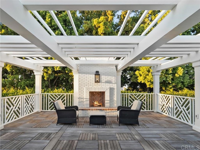 exterior space with an outdoor brick fireplace and a pergola