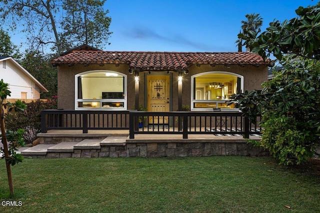 view of front of home with a yard