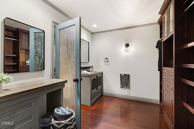 bathroom with hardwood / wood-style flooring, ornamental molding, and heating unit