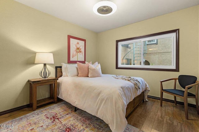 bedroom featuring dark hardwood / wood-style flooring